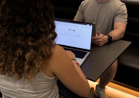 The Social Bay searching on Google and reviewing the results on a laptop